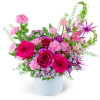 Pink and magenta rose arrangement in a white vase