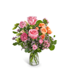 Pink and orange rose bouquet in a clear glass vase