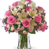 (ONE-SIDED) A beautiful blend of roses and lilies, creating a soft, romantic