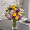 Bright yellow roses with purple and lavender blooms, white alstroemeria and pink