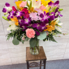 (ALL-ROUND) A vibrant, tropical-inspired bouquet featuring stunning dendros, elegant lilies, and soft