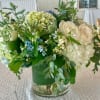 Hydrangeas, berries, thistle and roses in shades of blue and white in