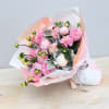 A romantic, garden-style hand-tied bouquet featuring a lush blend of soft pink