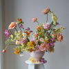 A statement making floral piece that invokes opulence and elegance.  Designed