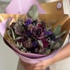 Deep, moody metallic purple roses and hot pink hues mingle with softer