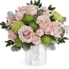 Pink roses and green mums in a mosaic vase