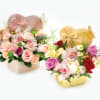 Two heart-shaped floral gift boxes with roses and orchids