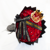Bouquet of red roses with a decorative crown and black ribbons