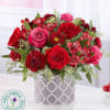 Red roses, hot pink roses, burgundy carnations, red alstroemeria, red matsumoto aster.