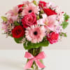 All-around arrangement with red and hot pink roses, pink Asiatic lilies, Peruvian