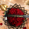 Bouquet of red roses with a gold rose and a "Quieres ser mi novia" ribbon