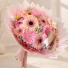 Pink and peach gerbera daisy bouquet wrapped in pastel paper