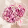 Pink peony bouquet wrapped in sheer paper with ribbon
