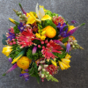 Vibrant + Energetic

Bursting with sunny ranunculus and vibrant roses, this makes for