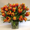 This tulip arrangement can come in a variety of colors: orange, yellow