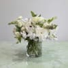 Lisianthus, Dahlias, Sweet Pea, and more white flower with greenery in glass