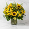 Yellow sunflower bouquet in a clear glass vase