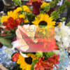 Mixed bouquet with sunflowers, roses, and lilies in bright colors