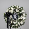 A beautiful, custom funeral wreath honoring a devoted fan. This elegant circular