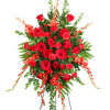 Large red floral standing spray on an easel