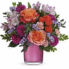 Bring a smile with vibrant roses and a polished gem cylinder, perfect