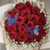 Bouquet of red roses with white baby's breath and blue butterfly picks