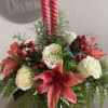 Red amaryllis and white roses with two pink candles