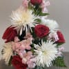 Red roses and white spider mums with pink filler flowers