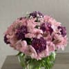 Pink and purple bouquet in a glass vase