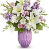 Purple vase with white lilies and lavender flowers
