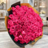 100 Fresh cut Roses with european style wrapping in our deluxe floral