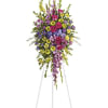 Tall standing floral spray with pink, purple, and yellow flowers