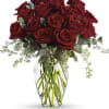 Bouquet of red roses in a clear glass vase
