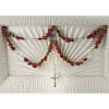 White casket spray with red rose garland and a small cross
