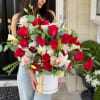 Large bouquet of red and white roses in a white hat box