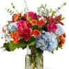Send your special someone this vibrant display of blooms, bursting with intense