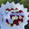 Bouquet of red and white roses with a white ribbon reading I LOVE YOU
