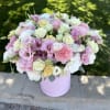 Pink and white mixed bouquet in a lavender hatbox