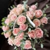 Bouquet of pale pink roses with eucalyptus accents