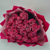 Bouquet of pink roses wrapped in pink paper