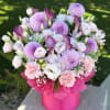 Pink and lavender bouquet in a bright pink box