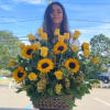 Large basket arrangement of yellow roses and sunflowers