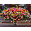 Large casket spray with mixed colorful flowers