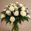 Cream-white roses clustered into a classic rounded bouquet create an elegant, celebratory