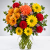 Colorful mixed bouquet in a clear glass vase