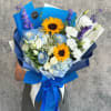 Bouquet of blue and white flowers with sunflowers wrapped in blue paper