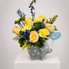Yellow roses and blue flowers in a gray polka-dot elephant vase with a "Hello Baby!" sign