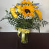 A beautiful vase with yellow roses and sunflowers. Perfect for national yellow