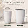 Two white ceramic planter pots in medium and large sizes