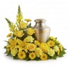 Yellow floral arrangement around a metal urn